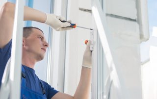 Worker reapiring window (Everything You Need To Know About Window Warranty)