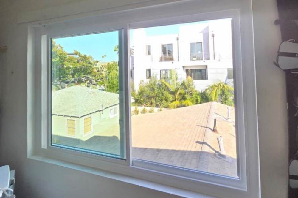 American Deluxe - Bronze Exterior and White Interior Anlin Windows for a Condomi - Copy